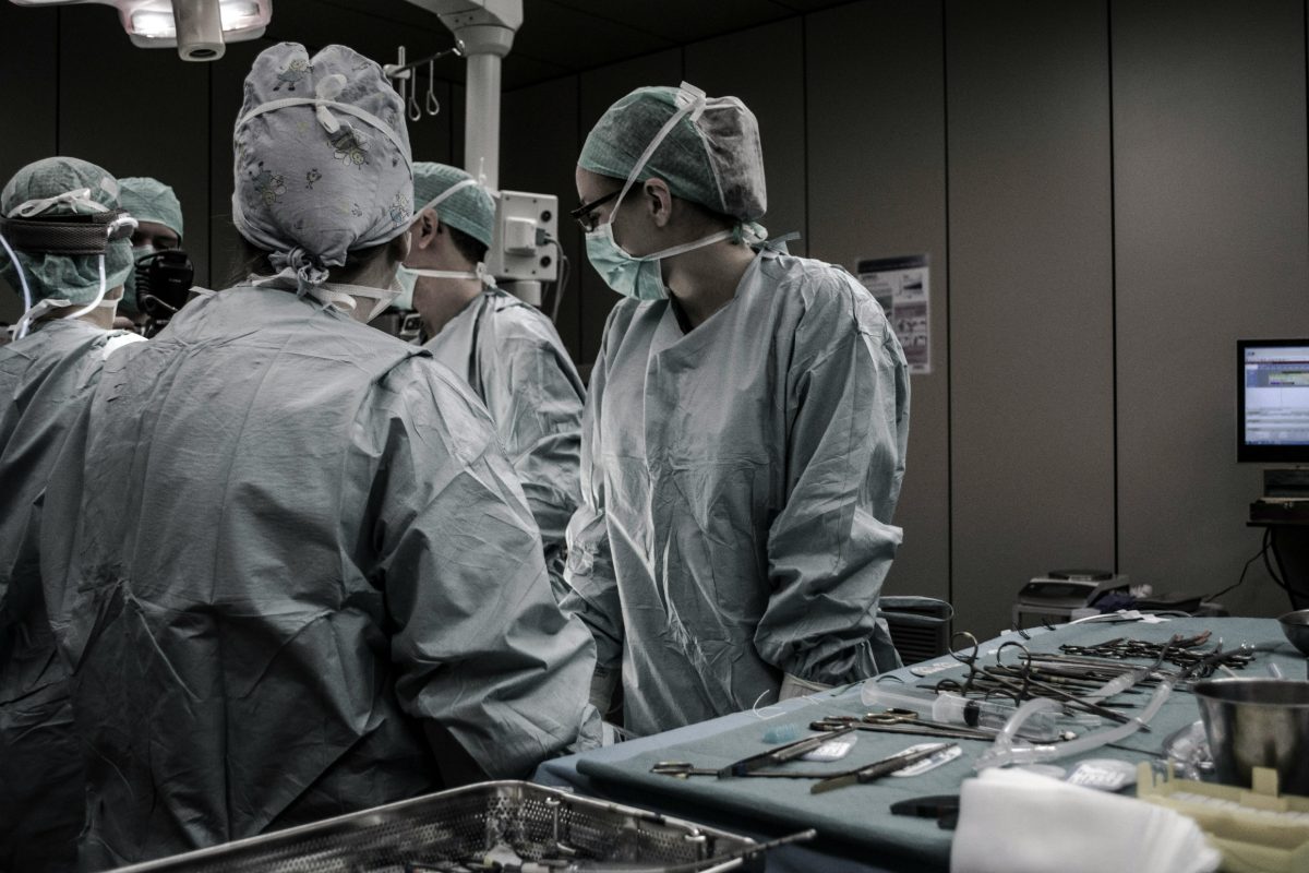 A surgical team at work, photographed from behind